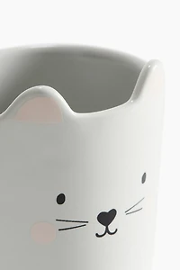 Tasse en porcelaine avec motif