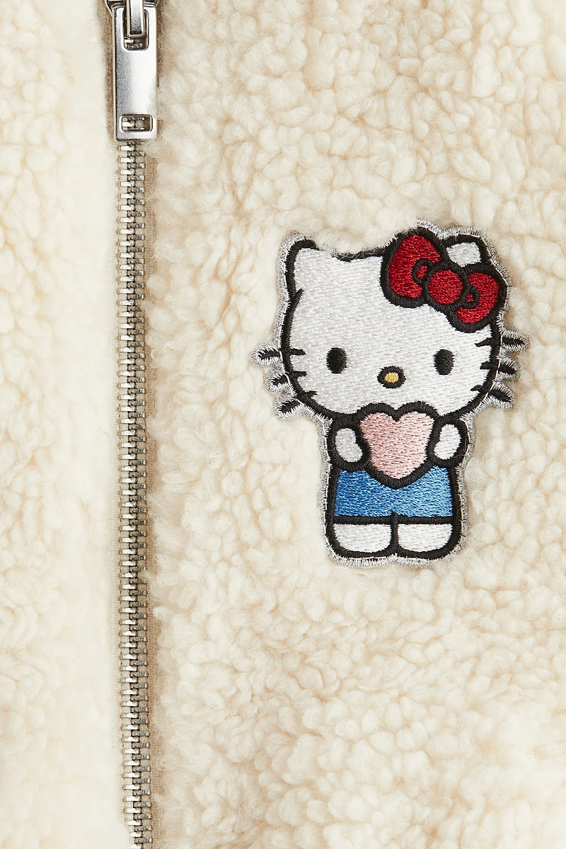 Blouson en tissu polar avec appliqués