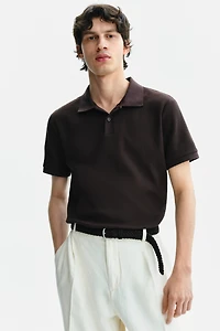 Polo près du corps en tricot gaufré