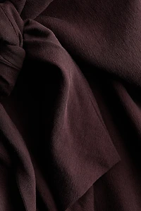 Pantalon à jambes tonneau avec détail nouer