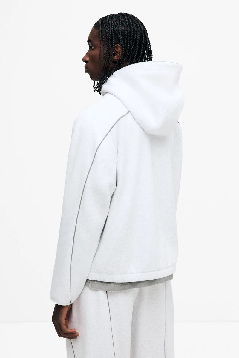 Veste à fermeture éclair ample avec capuchon