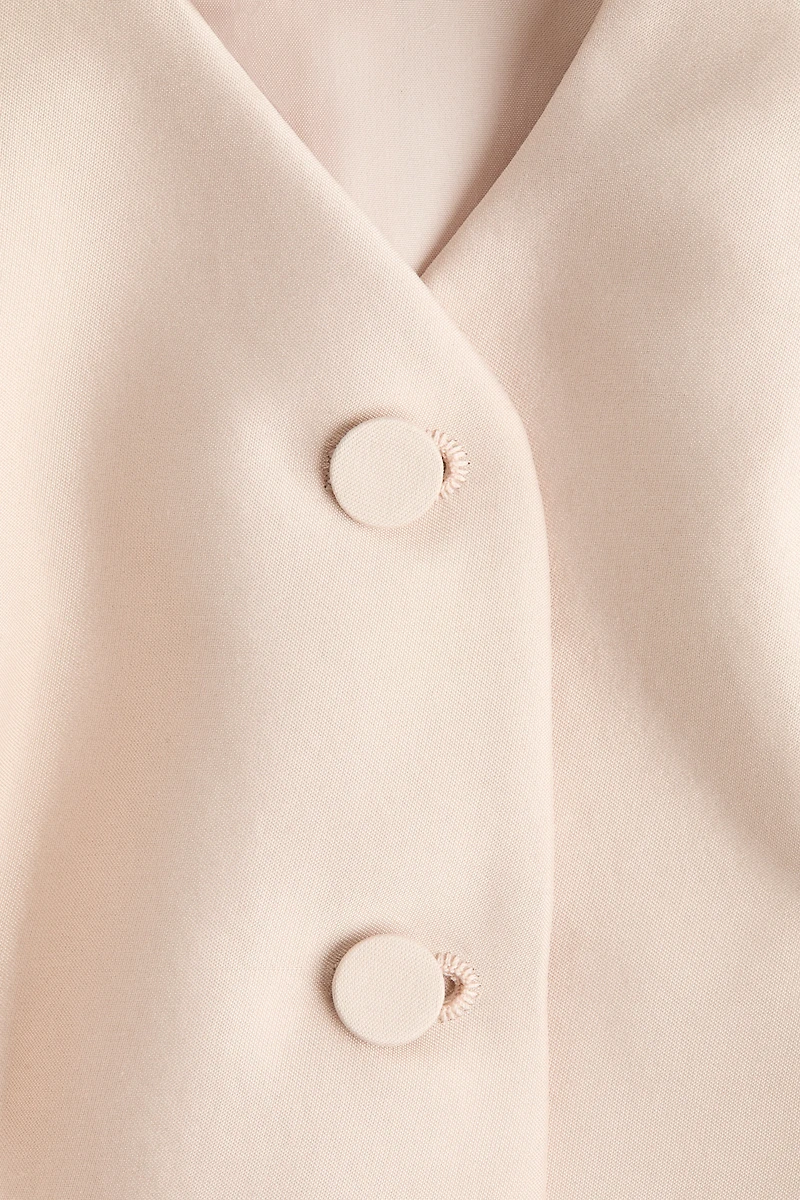 Chandail sans manches avec encolure en V et basque