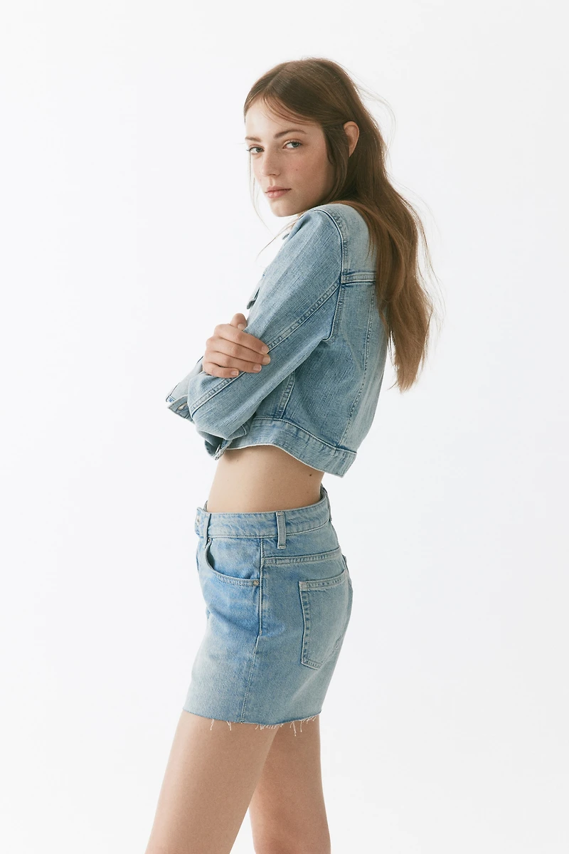 Raw-edge denim shorts