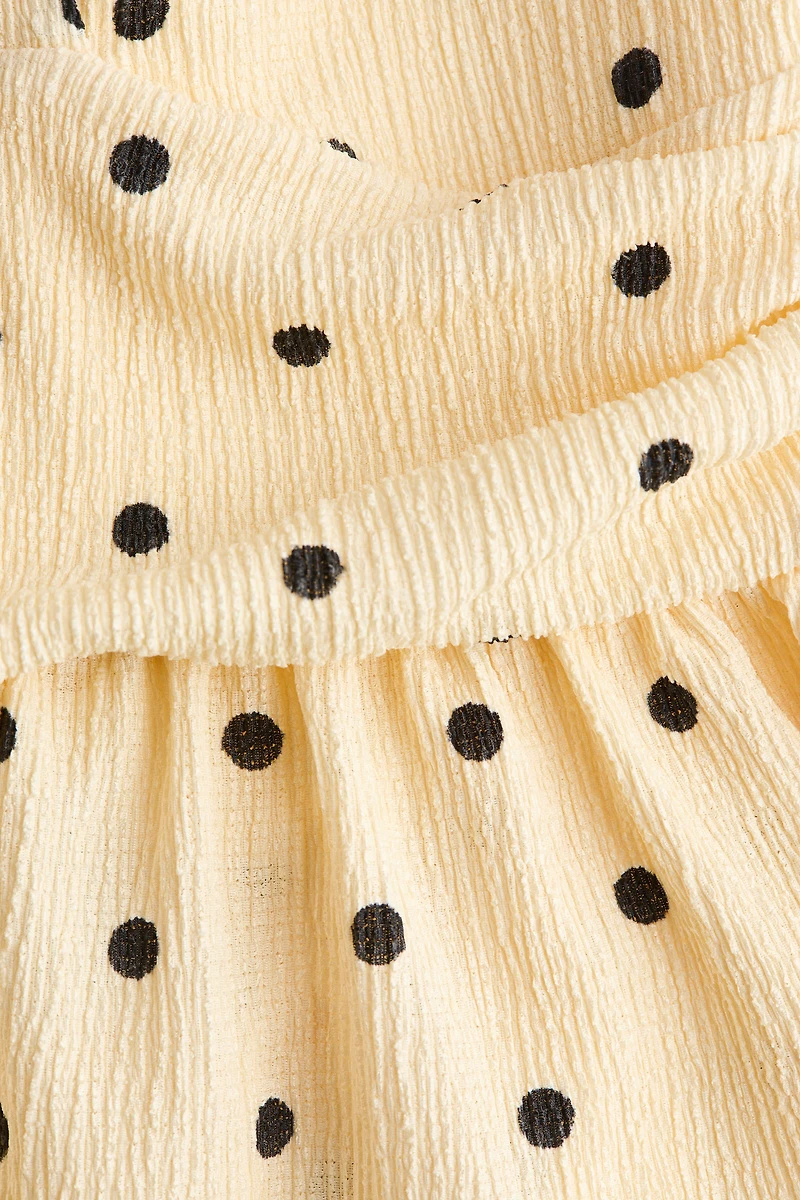 Haut péplum à dos nu