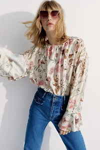 Blouse à poignets volantés