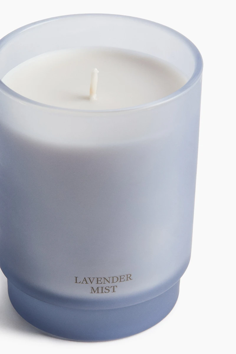 Bougie parfumée dans un pot en verre dépoli