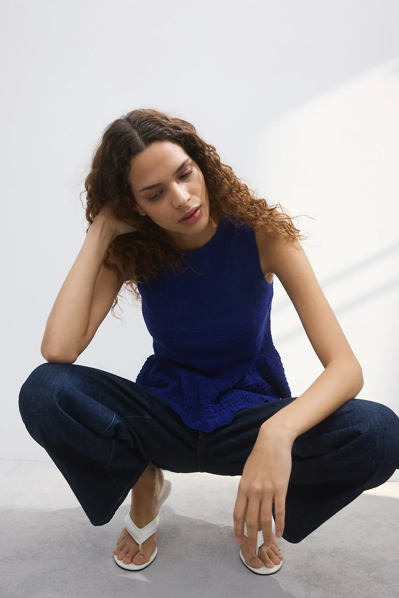 Pointelle-knit peplum top