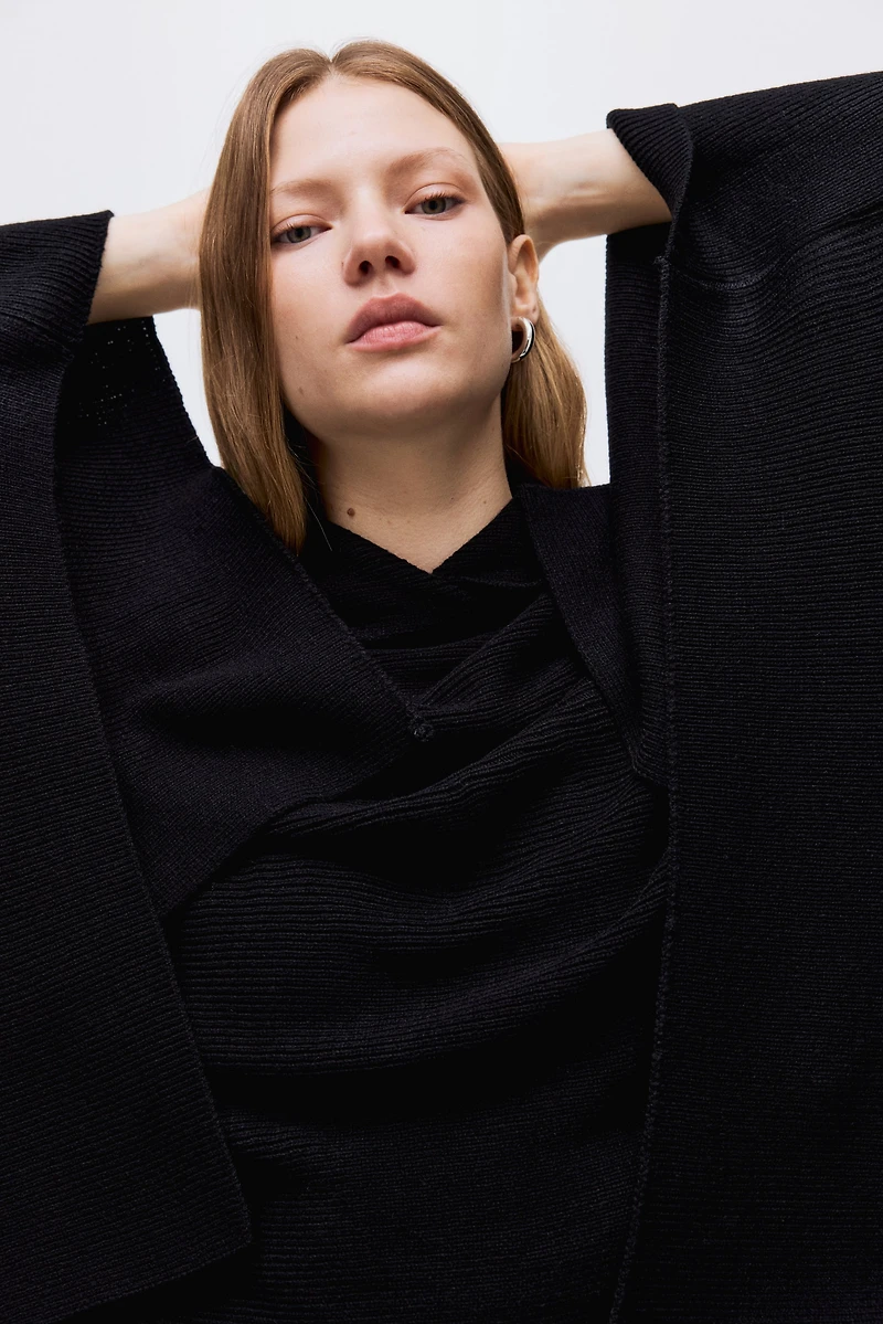 Cape en tricot côtelé