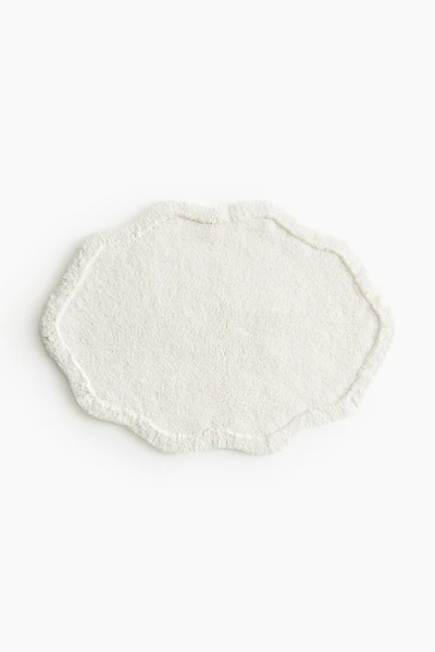 Tapis de bain en coton touffeté