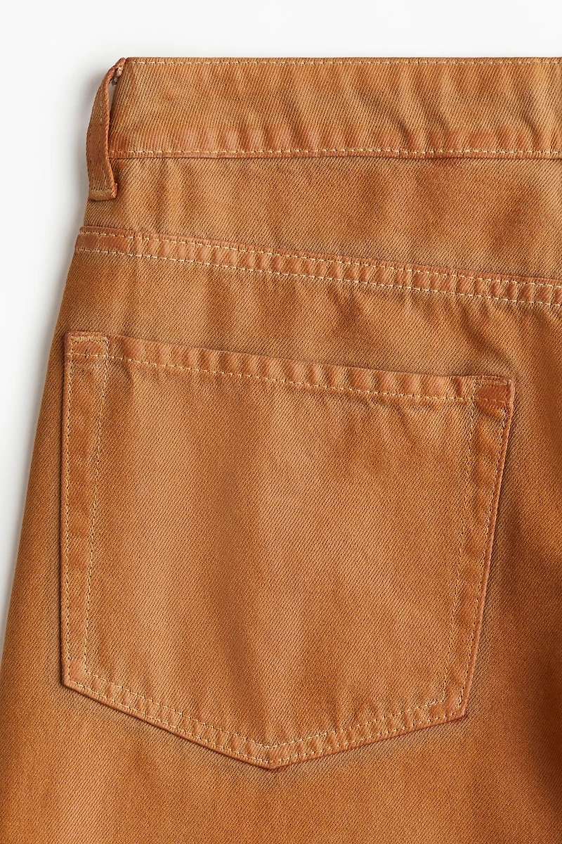 Pantalon large en tissu enduit