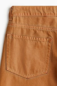 Pantalon large en tissu enduit