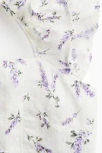 Blouse péplum avec détail à nouer