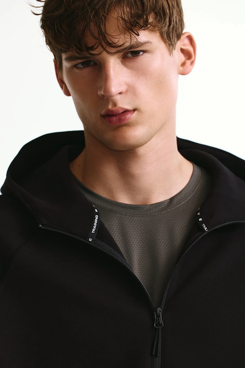 Veste sport fermeture éclair et capuche DryMove🅪