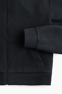 Veste gaufrée avec capuchon et glissière