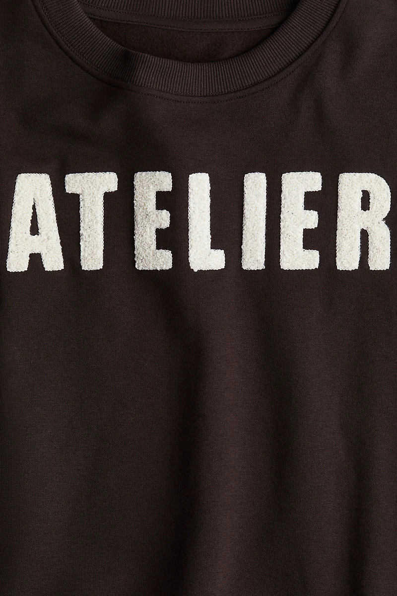Sweatshirt with Text Motif