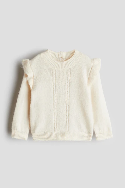 Chandail volanté à l'épaule