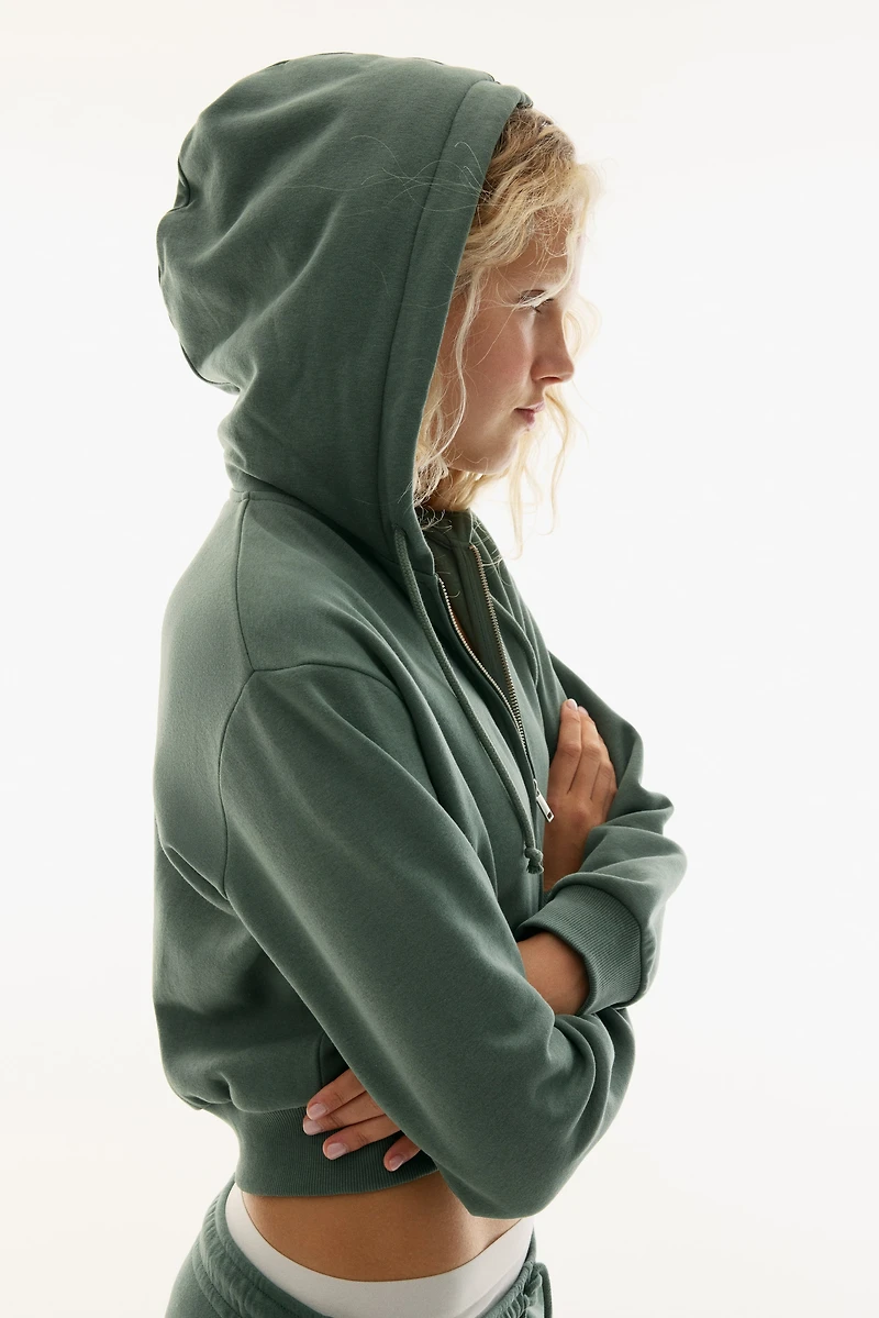 Veste courte avec capuchon et fermeture éclair