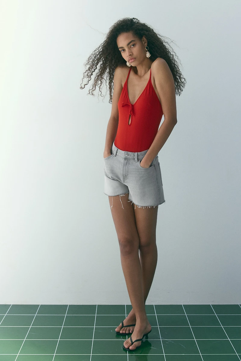 Raw-edge denim shorts