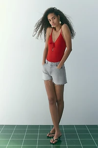 Raw-edge denim shorts