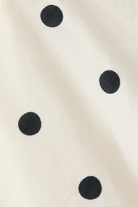 Robe dos nu à volants