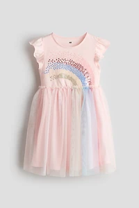 Robe avec motif à sequins et jupe en tulle