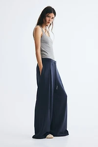 Pantalon avec cordon de serrage et plis