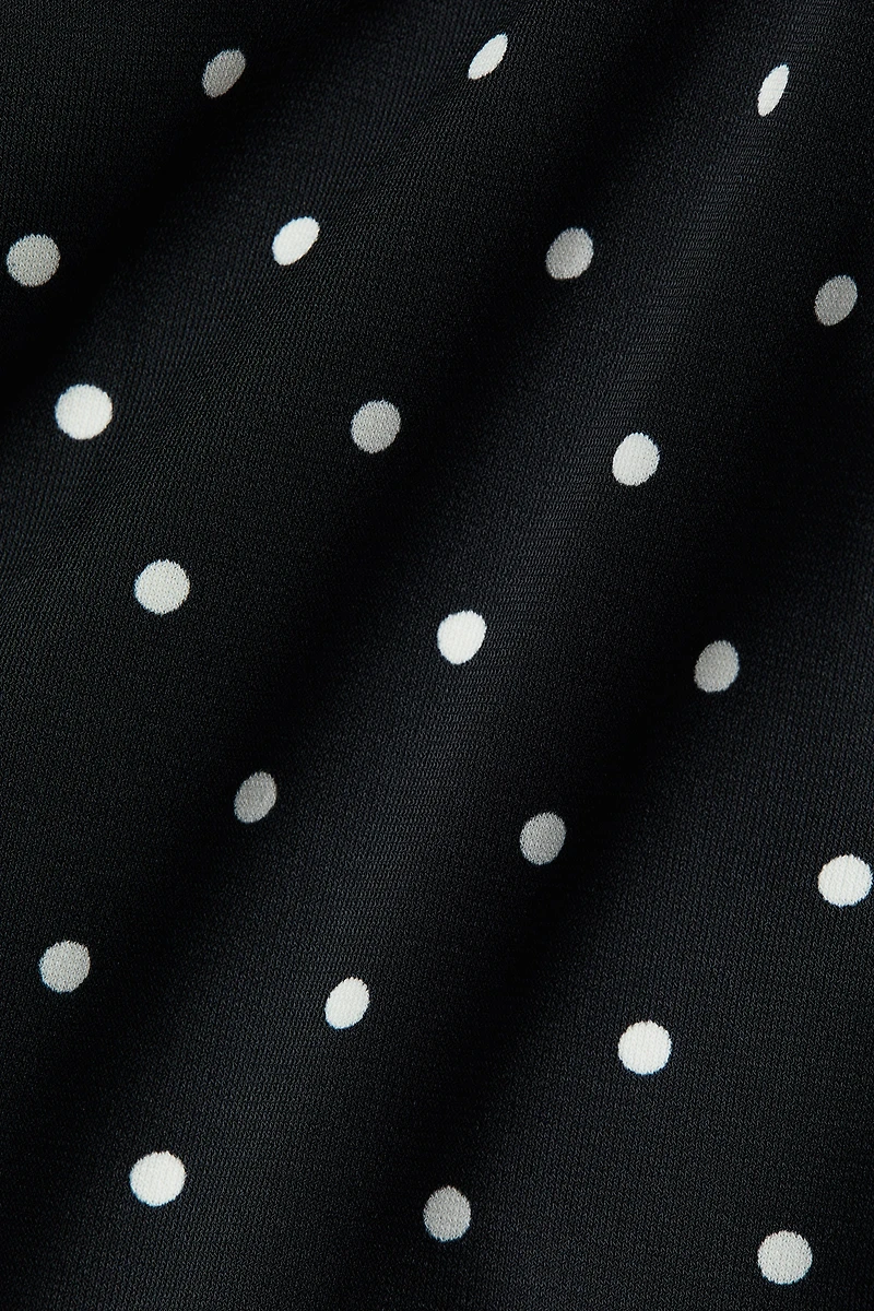 Haut péplum à dos dénudé