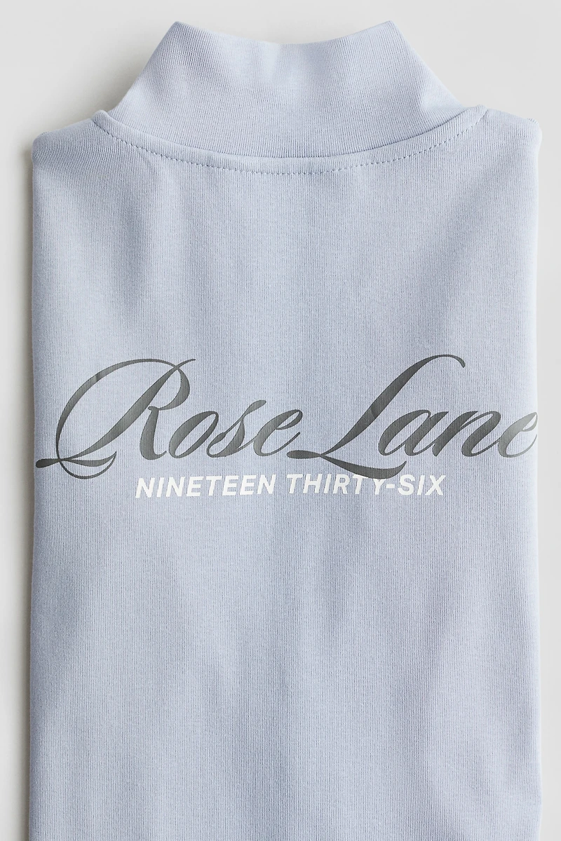 Veste à glissière avec motifs