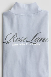 Veste à glissière avec motifs