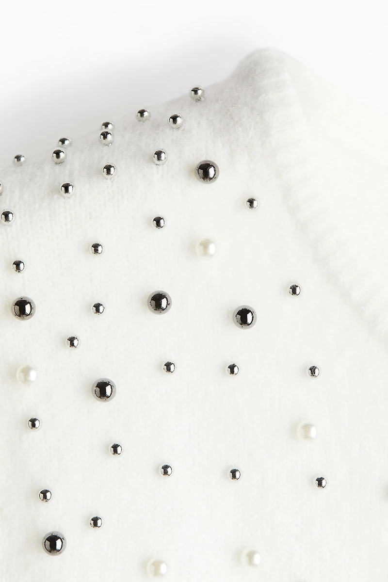 Haut ornementé en fin tricot