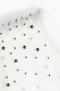 Haut ornementé en fin tricot