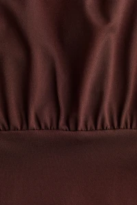 Cape-Sleeved Low-Back Dress