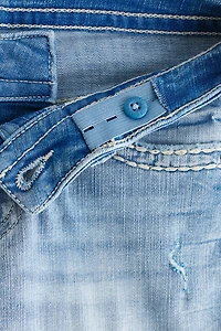 Jean près du corps semi-évasé taille basse