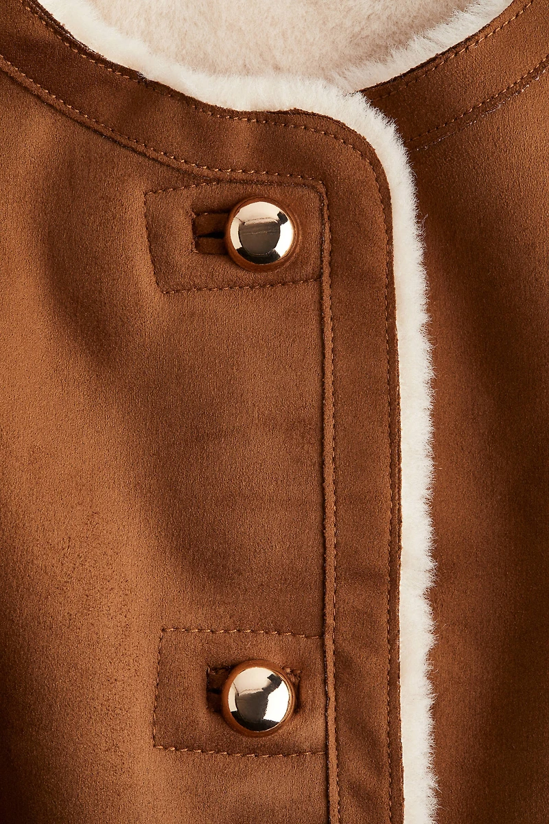 Veste sans manches doublée de tissu peluche