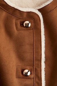 Veste sans manches doublée de tissu peluche