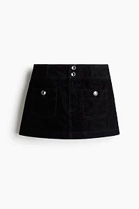 Minijupe avec boutons à strass