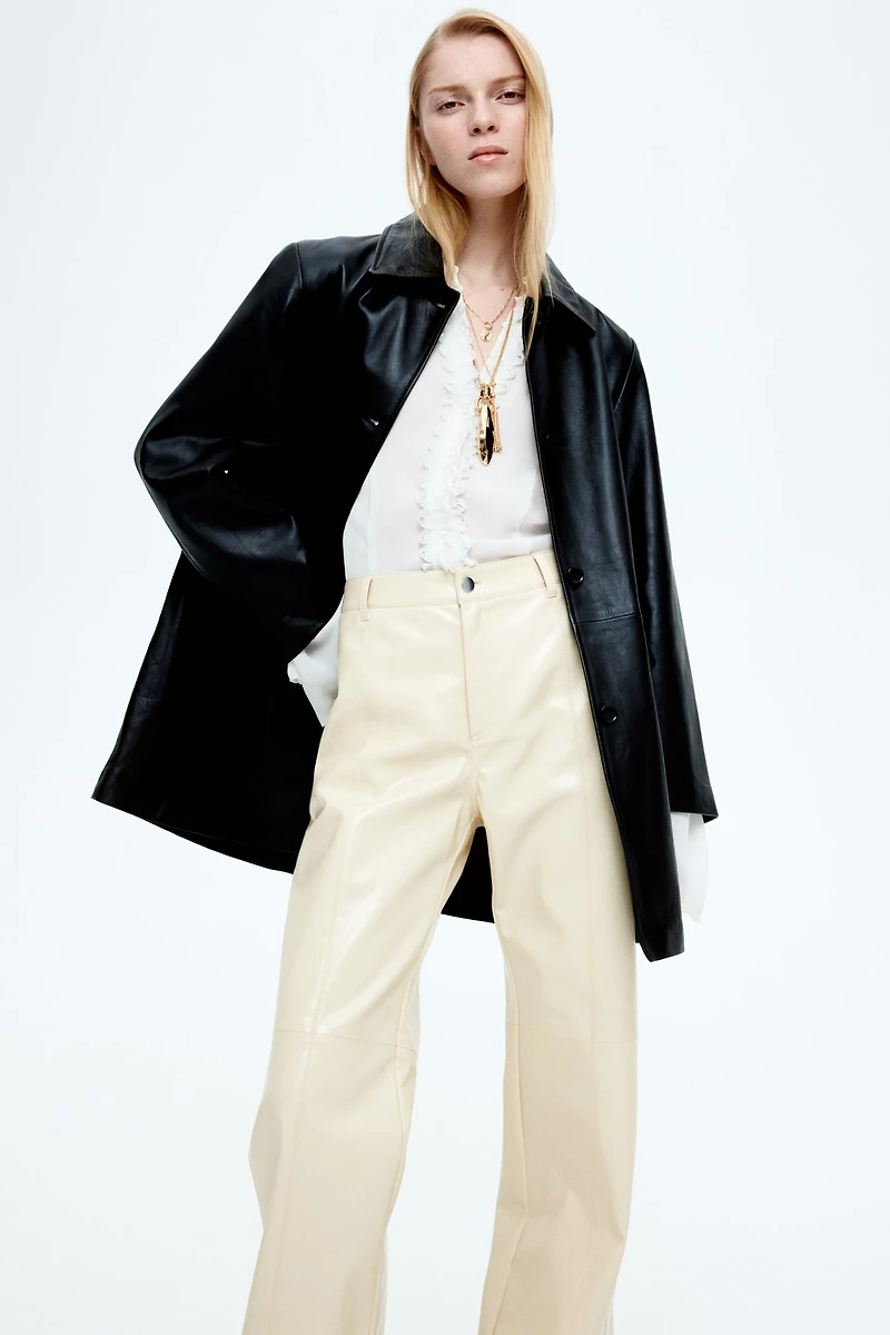 Pantalon en tissu enduit