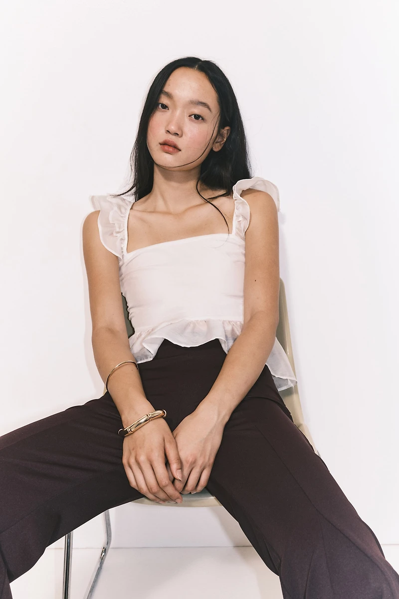 Blouse péplum avec détail à nouer