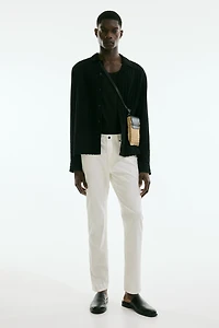 Pantalon aminci en tissu croisé de coton