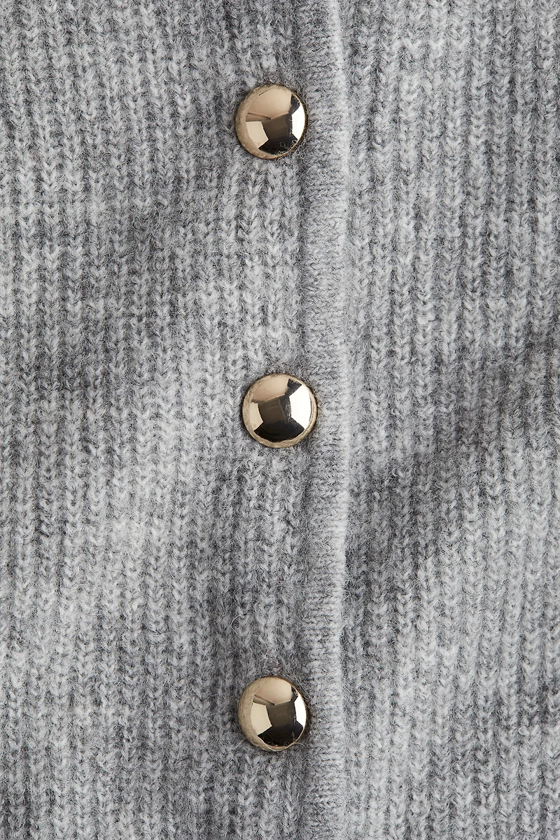 Gilet péplum en tricot côtelé