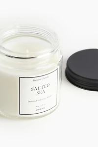 Bougie parfumée dans un pot en verre