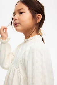 Blouse en jersey texturé