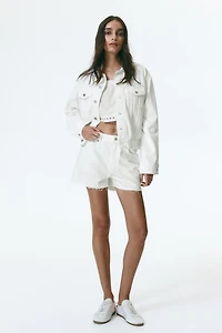 Raw-edge denim shorts