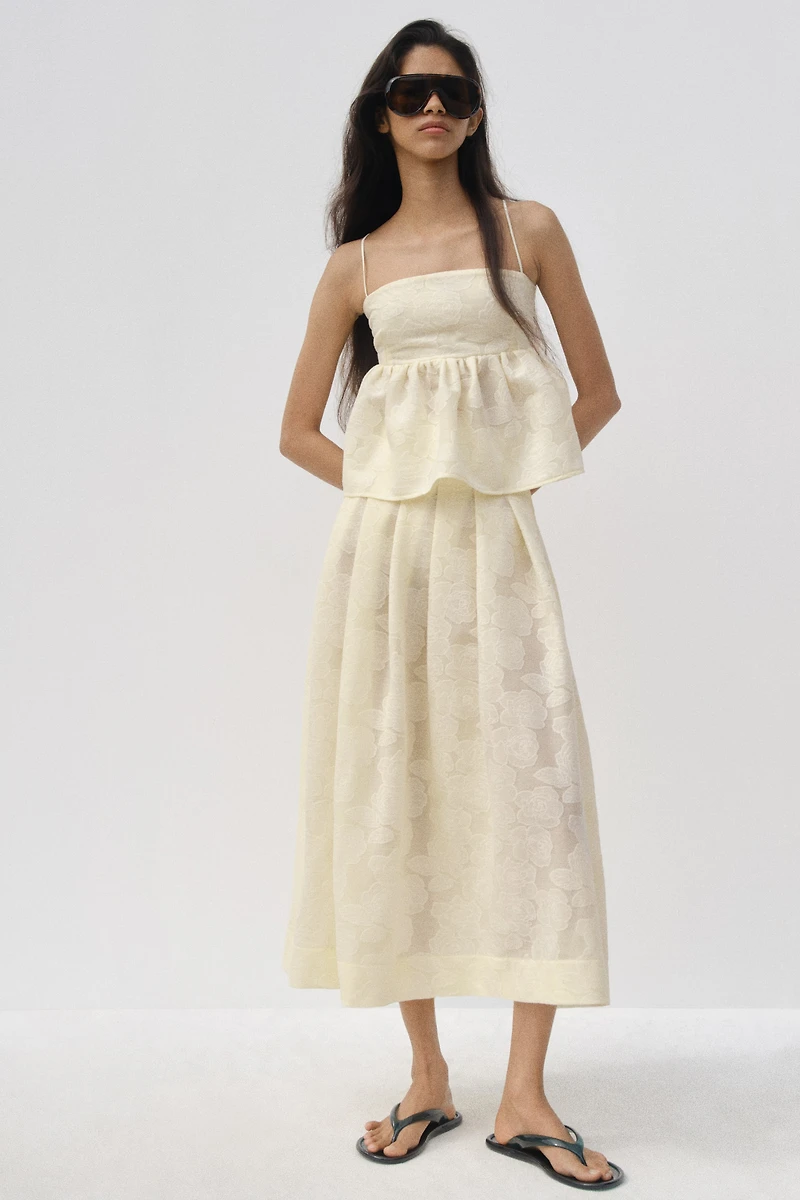 Haut péplum en tissu jacquard