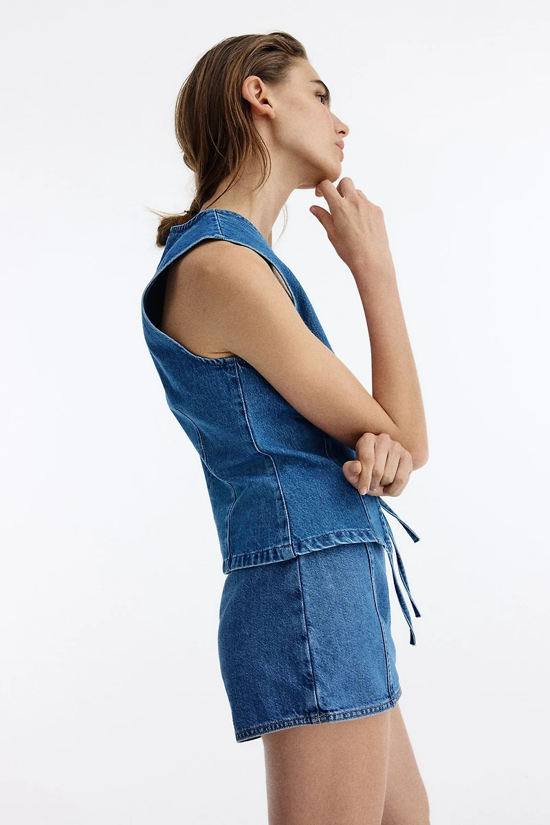 Gilet sans manches en denim avec liens à nouer