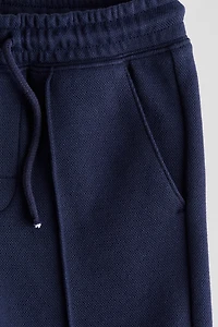 Short en piqué avec cordon de serrage