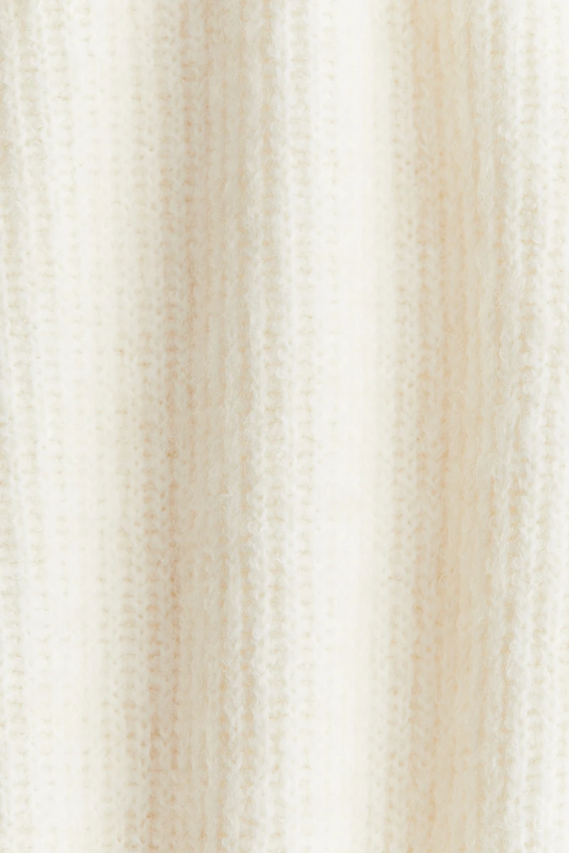 Haut péplum en tricot côtelé