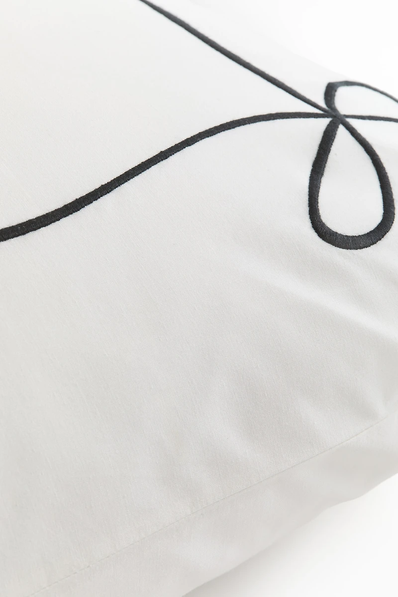 Taie d'oreiller brodée en percale de coton