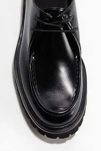 Chaussures rondelettes