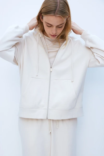 Veste à capuchon glissière